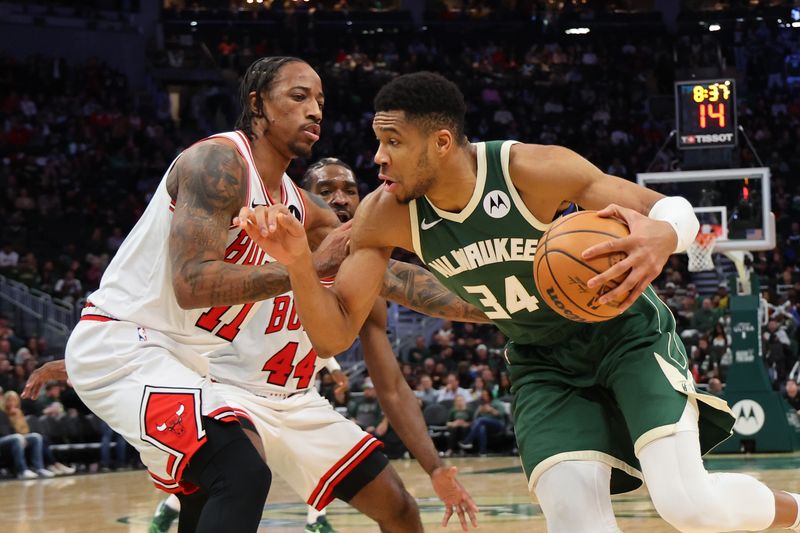 MILWAUKEE, WISCONSIN - DECEMBER 11: Giannis Antetokounmpo #34 of the Milwaukee Bucks drives to the basket against DeMar DeRozan #11 of the Chicago Bulls during the second half of a game at Fiserv Forum on December 11, 2023 in Milwaukee, Wisconsin. NOTE TO USER: User expressly acknowledges and agrees that, by downloading and or using this photograph, User is consenting to the terms and conditions of the Getty Images License Agreement. (Photo by Stacy Revere/Getty Images)