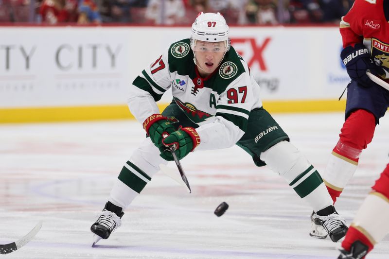 Jan 19, 2024; Sunrise, Florida, USA; Minnesota Wild left wing Kirill Kaprizov (97) moves the puck against the Florida Panthers during the first period at Amerant Bank Arena. Mandatory Credit: Sam Navarro-USA TODAY Sports