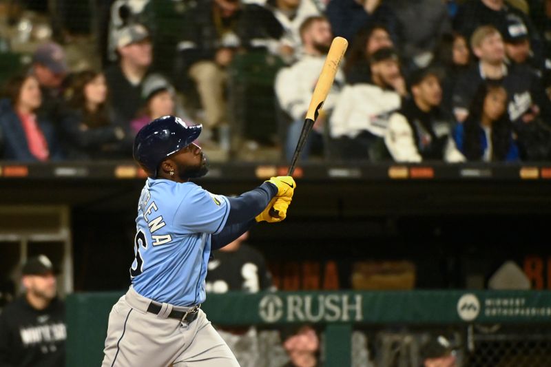 Apr 29, 2023; Chicago, Illinois, USA; Tampa Bay Rays left fielder Randy Arozarena (56) hits a three run home run against the Chicago White Sox during the seventh inning at Guaranteed Rate Field. Mandatory Credit: Matt Marton-USA TODAY Sports