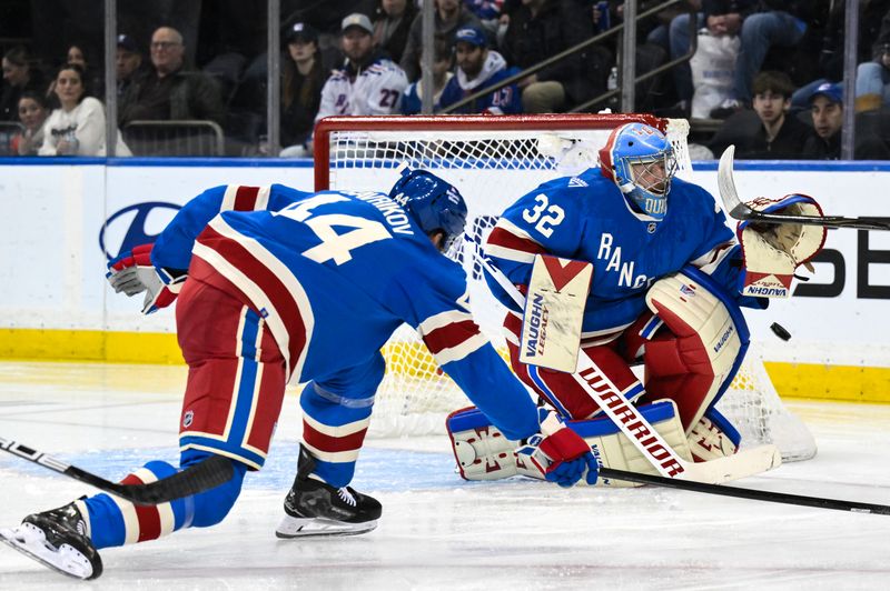 Nov 16, 2025; New York, New York, USA; New York Rangers goaltender Jonathan Quick (32) makes a save against the Detroit Red Wings during the second period at Madison Square Garden. Mandatory Credit: John Jones-Imagn Images