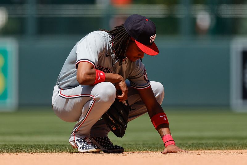 Jun 23, 2024; Denver, Colorado, USA; Washington Nationals shortstop CJ Abrams (5) during a stoppage of play in the seventh inning against the Colorado Rockies at Coors Field. Mandatory Credit: Isaiah J. Downing-USA TODAY Sports