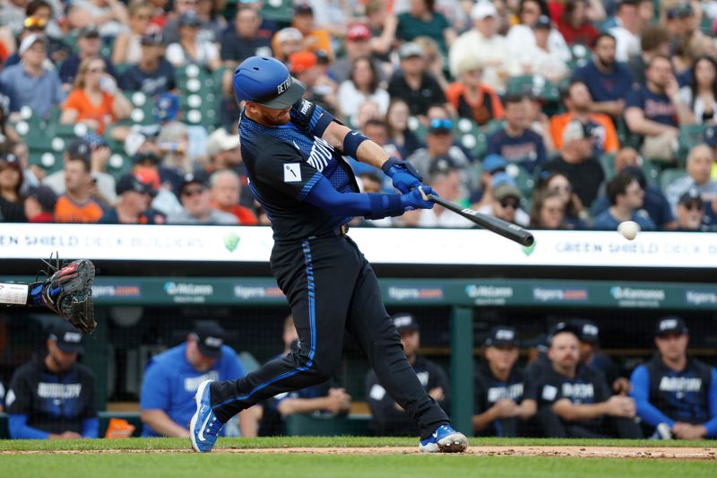 May 24, 2024; Detroit, Michigan, USA; Detroit Tigers catcher Carson Kelly (15) singles in the first inning of the game against the Toronto Blue Jays at Comerica Park. Mandatory Credit: Brian Bradshaw Sevald-USA TODAY Sports