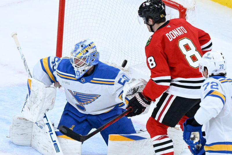 Jan 7, 2026; Chicago, Illinois, USA; Chicago Blackhawks center Ryan Donato (8) looks on as the puck hit by center Jason Dickinson (not pictured) gets past St. Louis Blues goaltender Jordan Binnington (50) during the second period at the United Center. Mandatory Credit: Matt Marton-Imagn Images