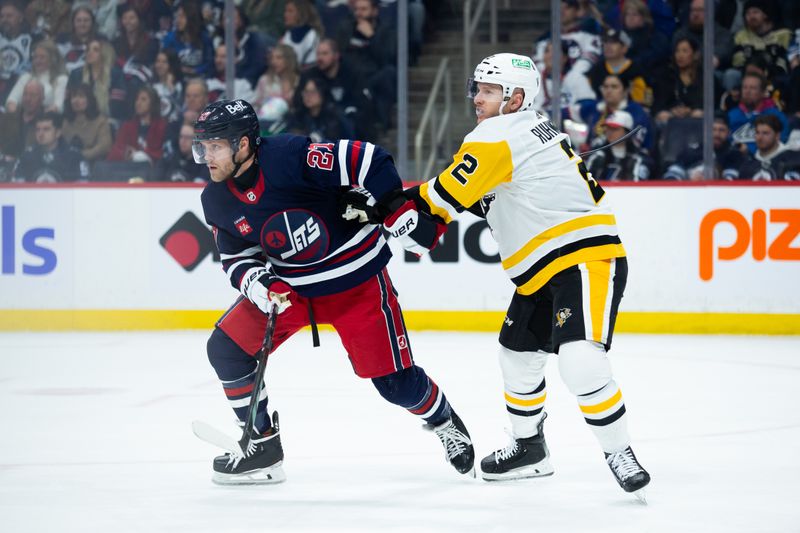 Feb 10, 2024; Winnipeg, Manitoba, CAN;  Pittsburgh Penguins defenseman Chad Ruhwedel (2) jostles for position with Winnipeg Jets forward Nikolaj Ehlers (27) during the second period at Canada Life Centre. Mandatory Credit: Terrence Lee-USA TODAY Sports