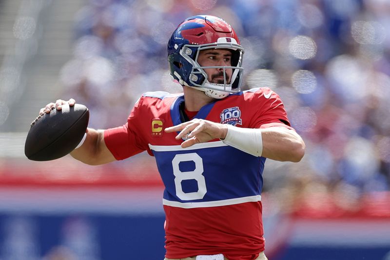 New York Giants quarterback Daniel Jones (8) looks to pass during the first half of an NFL football game against the Minnesota Vikings, Sunday, Sept. 8, 2024, in East Rutherford, N.J. (AP Photo/Adam Hunger)