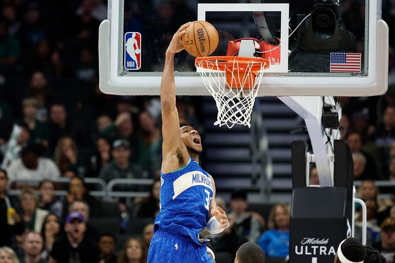 MILWAUKEE, WISCONSIN - MARCH 21: Giannis Antetokounmpo #34 of the Milwaukee Bucks scores on a dunk in the fourth quarter against the Brooklyn Nets at Fiserv Forum on March 21, 2024 in Milwaukee, Wisconsin. NOTE TO USER: User expressly acknowledges and agrees that, by downloading and or using this photograph, User is consenting to the terms and conditions of the Getty Images License Agreement. (Photo by John Fisher/Getty Images)