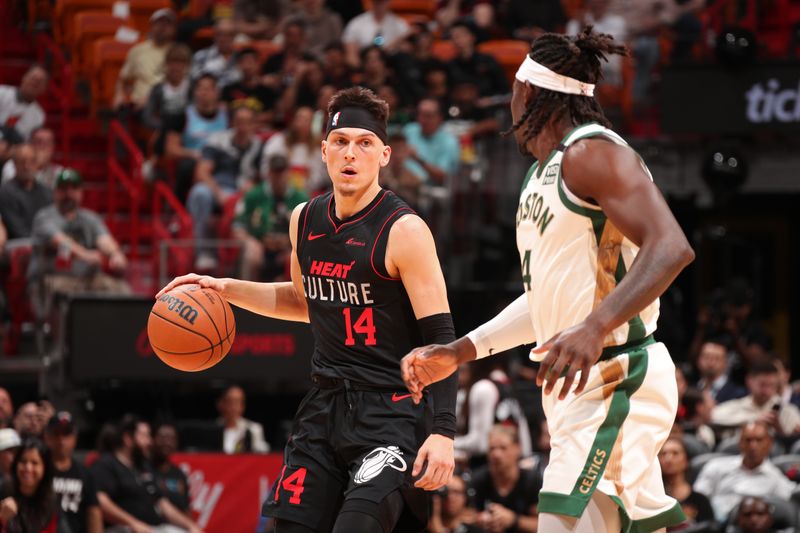 MIAMI, FL - FEBRUARY 11: Tyler Herro #14 of the Miami Heat dribbles the ball during the game against the Boston Celtics on February 11, 2024 at Kaseya Center in Miami, Florida. NOTE TO USER: User expressly acknowledges and agrees that, by downloading and or using this Photograph, user is consenting to the terms and conditions of the Getty Images License Agreement. Mandatory Copyright Notice: Copyright 2024 NBAE (Photo by Issac Baldizon/NBAE via Getty Images)