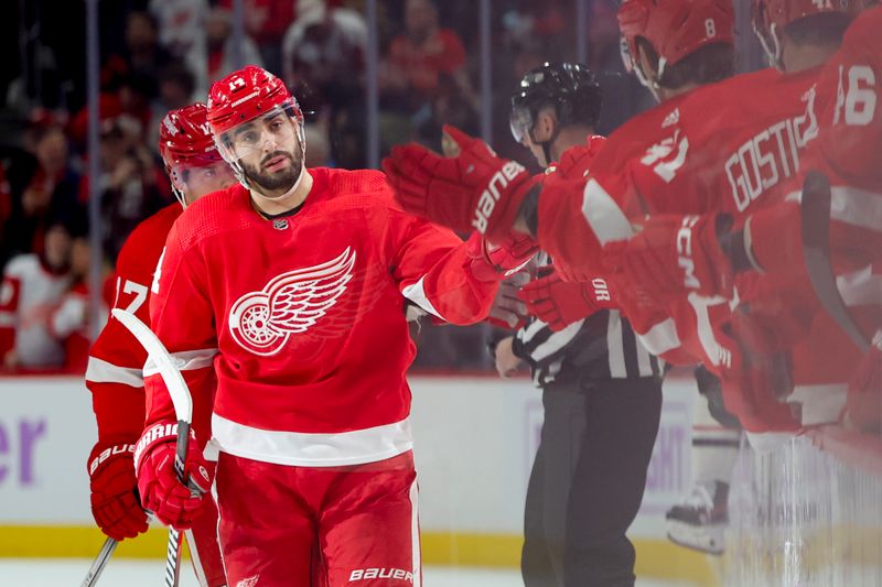 Nov 30, 2023; Detroit, Michigan, USA; Detroit Red Wings center Robby Fabbri (14) receives congratulations from teammates after scoring after scoring in the third period against the Chicago Blackhawks at Little Caesars Arena. Mandatory Credit: Rick Osentoski-USA TODAY Sports