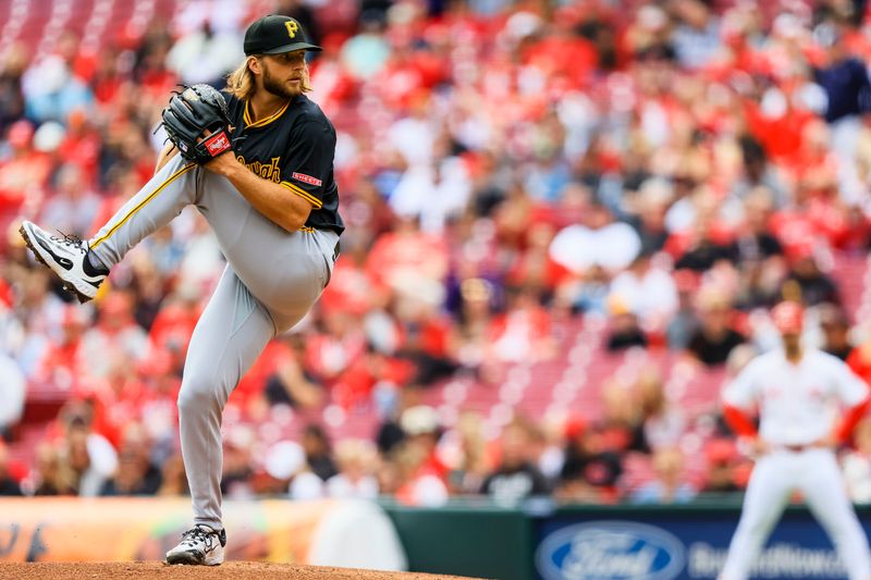 Apr 13, 2025; Cincinnati, Ohio, USA; Pittsburgh Pirates starting pitcher Carmen Mlodzinski (50) pitches against the Cincinnati Reds in the first inning at Great American Ball Park. Mandatory Credit: Katie Stratman-Imagn Images