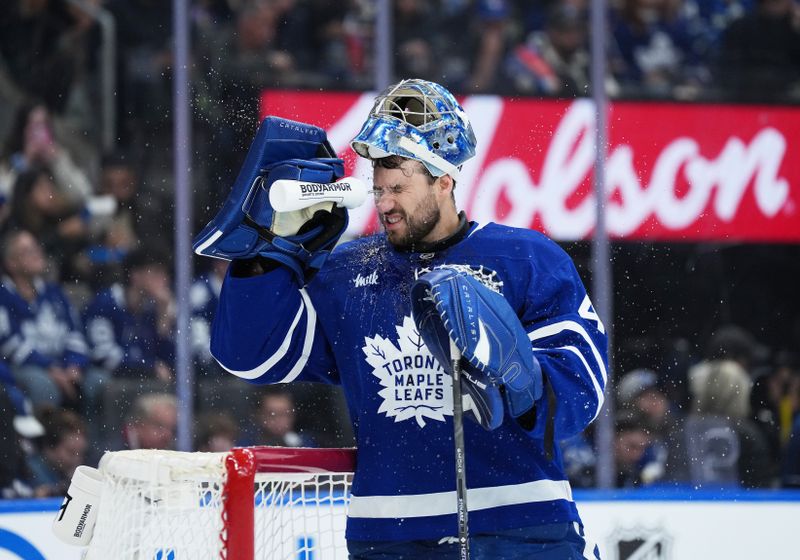 Oct 18, 2025; Toronto, Ontario, CAN; Toronto Maple Leafs goaltender Anthony Stolarz (41) sprays water into his face during the second period against the Seattle Kraken at Scotiabank Arena. Mandatory Credit: Nick Turchiaro-Imagn Images