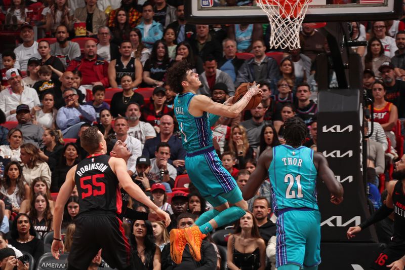 MIAMI, FL - JANUARY 14: LaMelo Ball #1 of the Charlotte Hornets drives to the basket during the game against the Miami Heat on January 14, 2024 at Kaseya Center in Miami, Florida. NOTE TO USER: User expressly acknowledges and agrees that, by downloading and or using this Photograph, user is consenting to the terms and conditions of the Getty Images License Agreement. Mandatory Copyright Notice: Copyright 2024 NBAE (Photo by Issac Baldizon/NBAE via Getty Images)