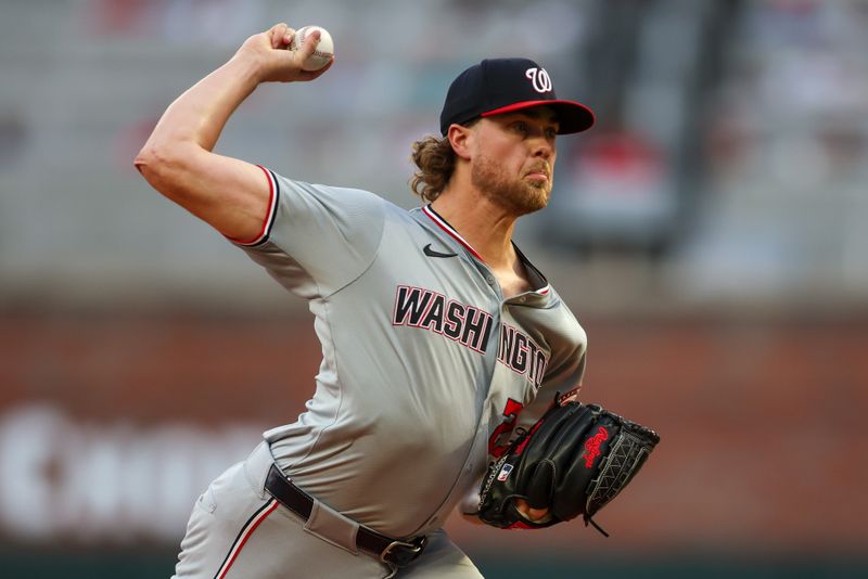 May 28, 2024; Atlanta, Georgia, USA; Washington Nationals starting pitcher Jake Irvin (27) throws against the Atlanta Braves in the third inning at Truist Park. Mandatory Credit: Brett Davis-USA TODAY Sports