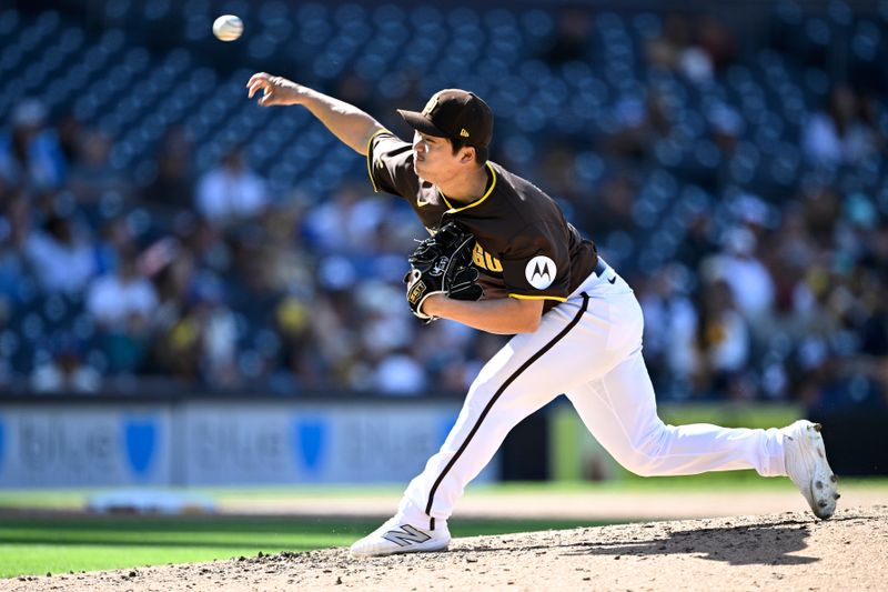 Mar 26, 2024; San Diego, California, USA; San Diego Padres relief pitcher Woo-Suk Go (21) throws a pitch against the Seattle Mariners during the ninth inning at Petco Park. Mandatory Credit: Orlando Ramirez-USA TODAY Sports