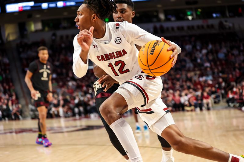 Jan 14, 2023; Columbia, South Carolina, USA; South Carolina Gamecocks guard Zachary Davis (12) drives against the Texas A&M Aggies in the first half at Colonial Life Arena. Mandatory Credit: Jeff Blake-USA TODAY Sports