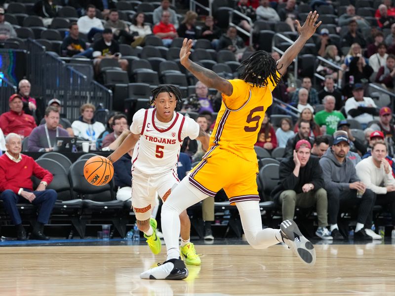 Mar 9, 2023; Las Vegas, NV, USA; USC Trojans guard Boogie Ellis (5) dribbles against Arizona State Sun Devils forward Jamiya Neal (5) during the second half at T-Mobile Arena. Mandatory Credit: Stephen R. Sylvanie-USA TODAY Sports