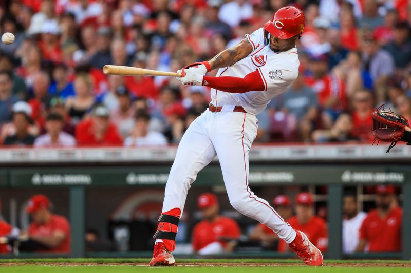 Jun 6, 2024; Cincinnati, Ohio, USA; Cincinnati Reds outfielder Will Benson (30) hits a single against the Chicago Cubs in the third inning at Great American Ball Park. Mandatory Credit: Katie Stratman-USA TODAY Sports