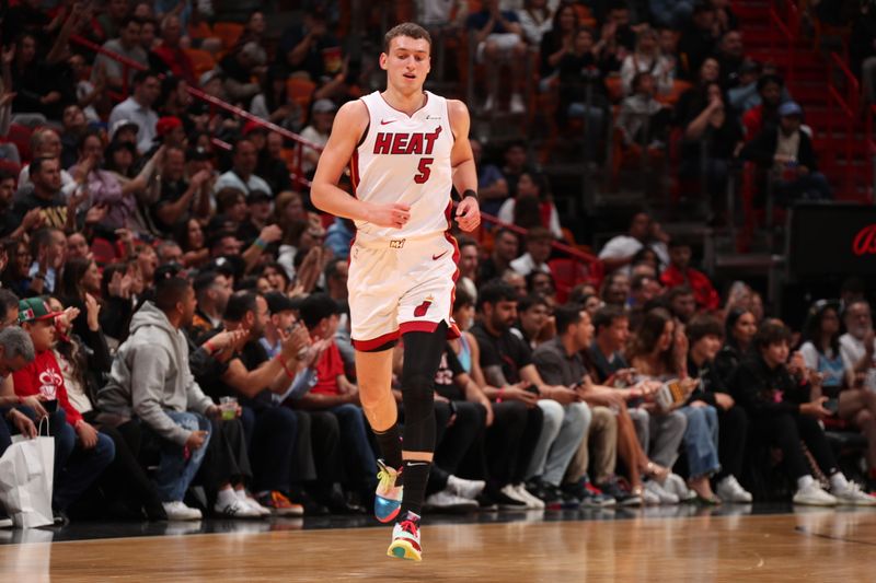 MIAMI, FL - JANUARY 8: Nikola Jovic #5 of the Miami Heat looks on during the game against the Houston Rockets on January 8, 2024 at Kaseya Center in Miami, Florida. NOTE TO USER: User expressly acknowledges and agrees that, by downloading and or using this Photograph, user is consenting to the terms and conditions of the Getty Images License Agreement. Mandatory Copyright Notice: Copyright 2024 NBAE (Photo by Issac Baldizon/NBAE via Getty Images)