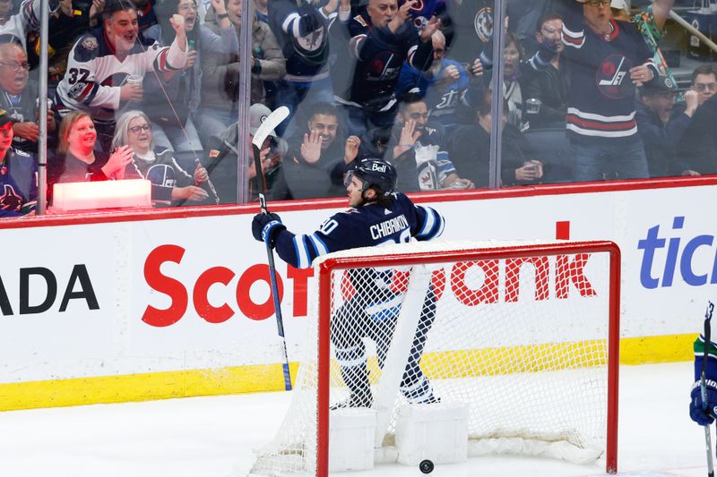 Apr 18, 2024; Winnipeg, Manitoba, CAN;  Winnipeg Jets forward Nikita Chibrikov (90) celebrates his first NHL goal against the Vancouver Canucks during the third period at Canada Life Centre. Mandatory Credit: Terrence Lee-USA TODAY Sports