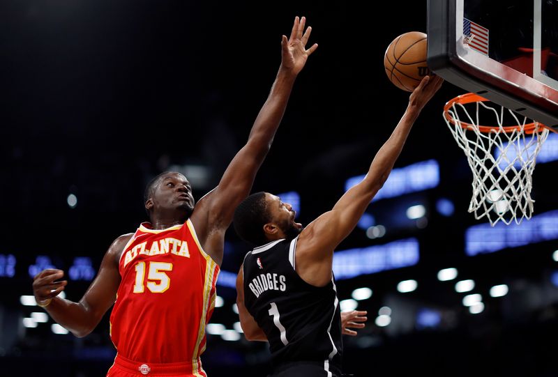 NEW YORK, NEW YORK - MARCH 02: Mikal Bridges #1 of the Brooklyn Nets goes to the basket as Clint Capela #15 of the Atlanta Hawks defends during the first half at Barclays Center on March 02, 2024 in the Brooklyn borough of New York City. NOTE TO USER: User expressly acknowledges and agrees that, by downloading and or using this photograph, User is consenting to the terms and conditions of the Getty Images License Agreement. (Photo by Sarah Stier/Getty Images)