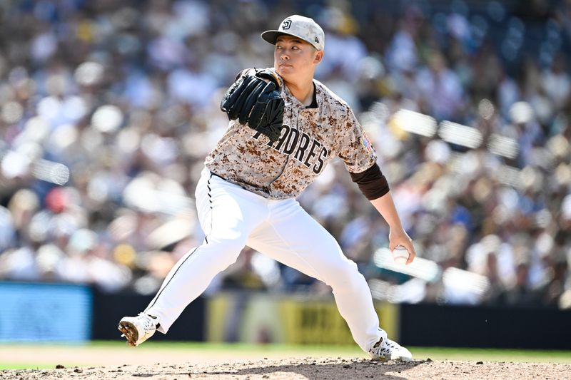 May 18, 2025; San Diego, California, USA; San Diego Padres relief pitcher Yuki Matsui (1) delivers during the ninth inning against the Seattle Mariners at Petco Park. Mandatory Credit: Denis Poroy-Imagn Images