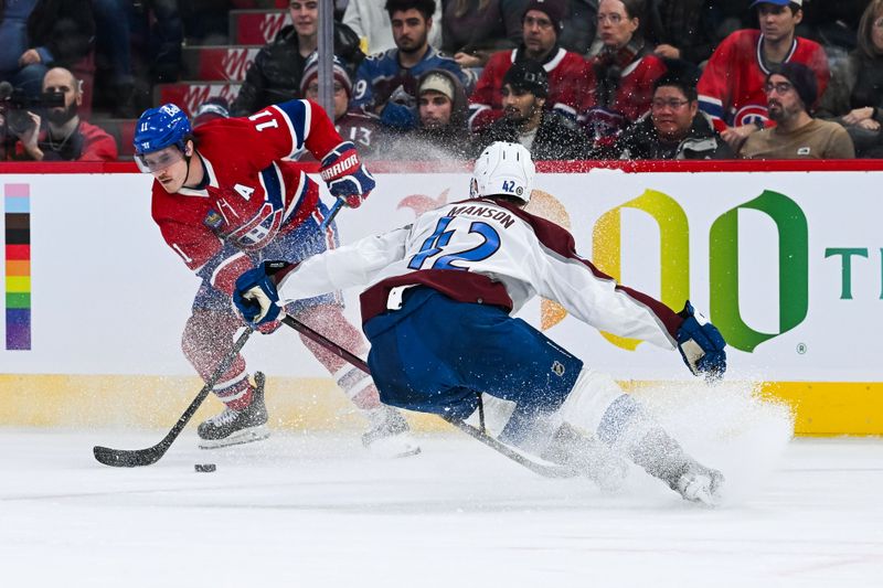 Jan 15, 2024; Montreal, Quebec, CAN; Montreal Canadiens right wing Brendan Gallagher (11) plays the puck against Colorado Avalanche defenseman Josh Manson (42) during the first period at Bell Centre. Mandatory Credit: David Kirouac-USA TODAY Sports