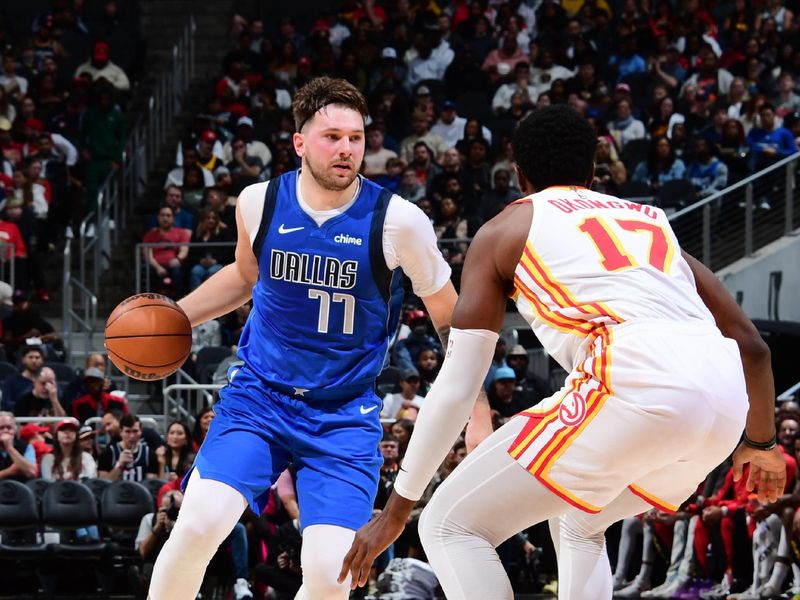 ATLANTA, GA - JANUARY 26: Luka Doncic #77 of the Dallas Mavericks dribbles the ball during the game against the Atlanta Hawks on January 26, 2024 at State Farm Arena in Atlanta, Georgia.  NOTE TO USER: User expressly acknowledges and agrees that, by downloading and/or using this Photograph, user is consenting to the terms and conditions of the Getty Images License Agreement. Mandatory Copyright Notice: Copyright 2024 NBAE (Photo by Scott Cunningham/NBAE via Getty Images)