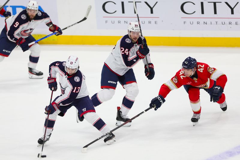 Nov 6, 2023; Sunrise, Florida, USA; Columbus Blue Jackets left wing Johnny Gaudreau (13) moves the puck against the Florida Panthers during the third period at Amerant Bank Arena. Mandatory Credit: Sam Navarro-USA TODAY Sports