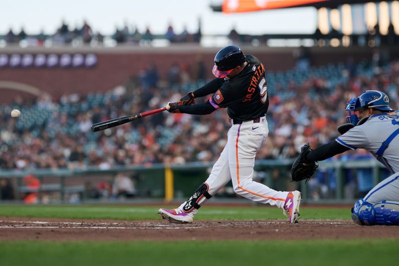 May 20, 2025; San Francisco, California, USA; San Francisco Giants right fielder Mike Yastrzemski (5) hits a single against the Kansas City Royals during the third inning at Oracle Park. Mandatory Credit: Robert Edwards-Imagn Images