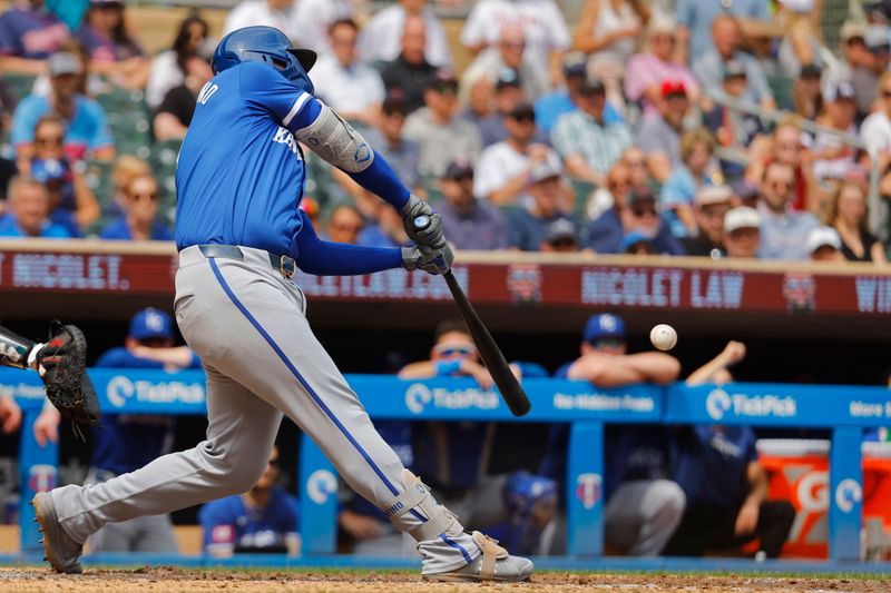 Aug 14, 2024; Minneapolis, Minnesota, USA; Kansas City Royals designated hitter Vinnie Pasquantino (9) hits an RBI double against the Minnesota Twins in the seventh inning at Target Field. Mandatory Credit: Bruce Kluckhohn-USA TODAY Sports