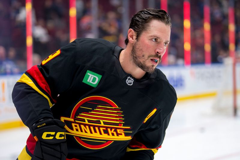 Nov 9, 2024; Vancouver, British Columbia, CAN; Vancouver Canucks forward J.T. Miller (9) skates during warm up prior to a game against the Edmonton Oilers at Rogers Arena. Mandatory Credit: Bob Frid-Imagn Images