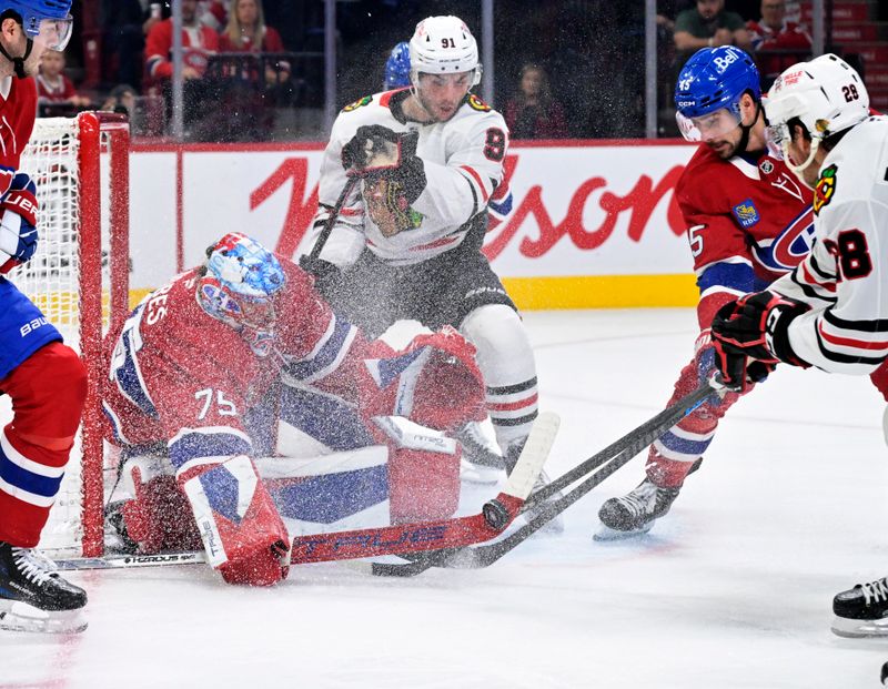 Dec 18, 2025; Montreal, Quebec, CAN; Montreal Canadiens goalie Jakub Dobes (75) stops Chicago Blackhawks forward Andre Burakovsky (28) during the second period at the Bell Centre. Mandatory Credit: Eric Bolte-Imagn Images