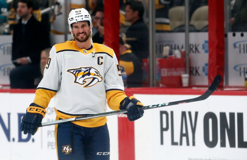 Apr 15, 2024; Pittsburgh, Pennsylvania, USA; Nashville Predators defenseman Roman Josi (59) warms up before the game against he Pittsburgh Penguins at PPG Paints Arena. Mandatory Credit: Charles LeClaire-USA TODAY Sports