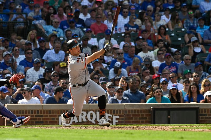 Sep 6, 2023; Chicago, Illinois, USA;  San Francisco Giants shortstop Casey Schmitt (6) hits an RBI double against the Chicago Cubs during the seventh inning at Wrigley Field. Mandatory Credit: Matt Marton-USA TODAY Sports