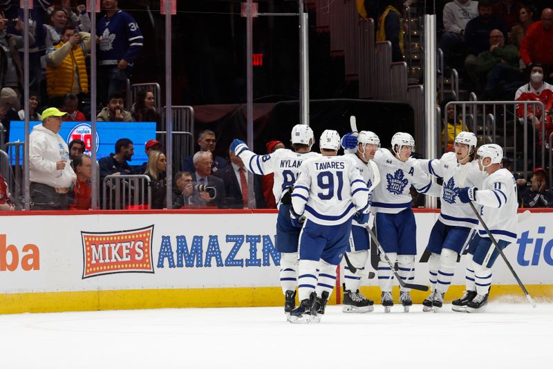 Nov 13, 2024; Washington, District of Columbia, USA; Toronto Maple Leafs right wing Mitch Marner (16) celebrates after scoring the game tying goal against the Washington Capitals in the final minute of the third period at Capital One Arena. Mandatory Credit: Geoff Burke-Imagn Images