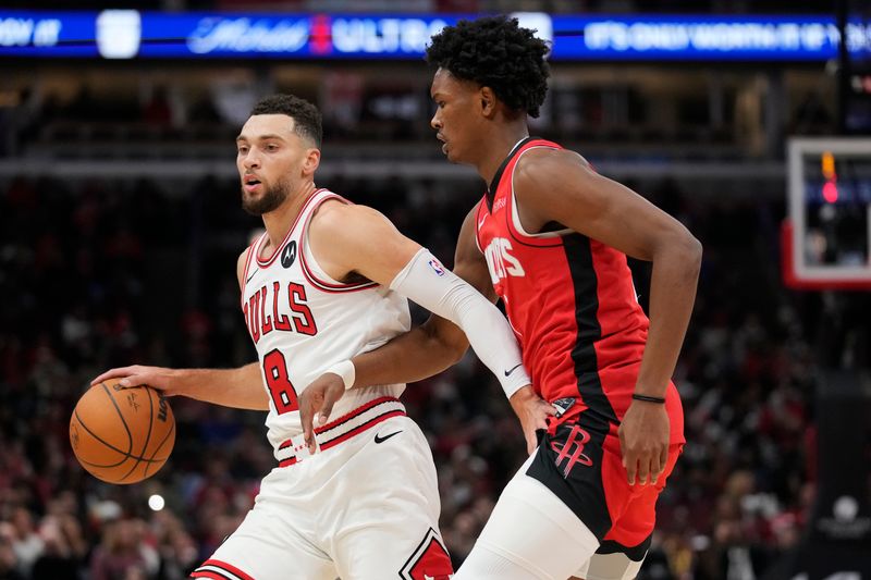 CHICAGO, ILLINOIS - NOVEMBER 17: Zach LaVine #8 of the Chicago Bulls dribbles the ball against Amen Thompson #1 of the Houston Rockets during the first quarter at the United Center on November 17, 2024 in Chicago, Illinois. NOTE TO USER: User expressly acknowledges and agrees that, by downloading and or using this photograph, User is consenting to the terms and conditions of the Getty Images License Agreement. (Photo by Patrick McDermott/Getty Images)