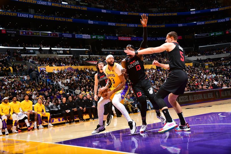 LOS ANGELES, CA - JANUARY 3: Anthony Davis #3 of the Los Angeles Lakers handles the ball during the game against the Miami Heat on January 3, 2024 at Crypto.Com Arena in Los Angeles, California. NOTE TO USER: User expressly acknowledges and agrees that, by downloading and/or using this Photograph, user is consenting to the terms and conditions of the Getty Images License Agreement. Mandatory Copyright Notice: Copyright 2024 NBAE (Photo by Adam Pantozzi/NBAE via Getty Images)