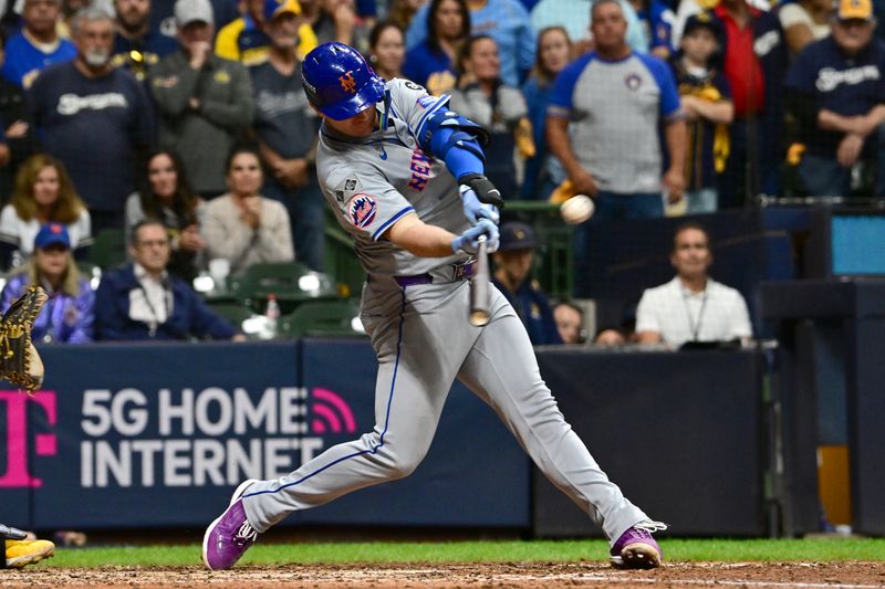 Oct 3, 2024; Milwaukee, Wisconsin, USA; New York Mets first baseman Pete Alonso (20) hits a three run home run against the Milwaukee Brewers in the ninth inning during game three of the Wildcard round for the 2024 MLB Playoffs at American Family Field. Mandatory Credit: Benny Sieu-Imagn Images