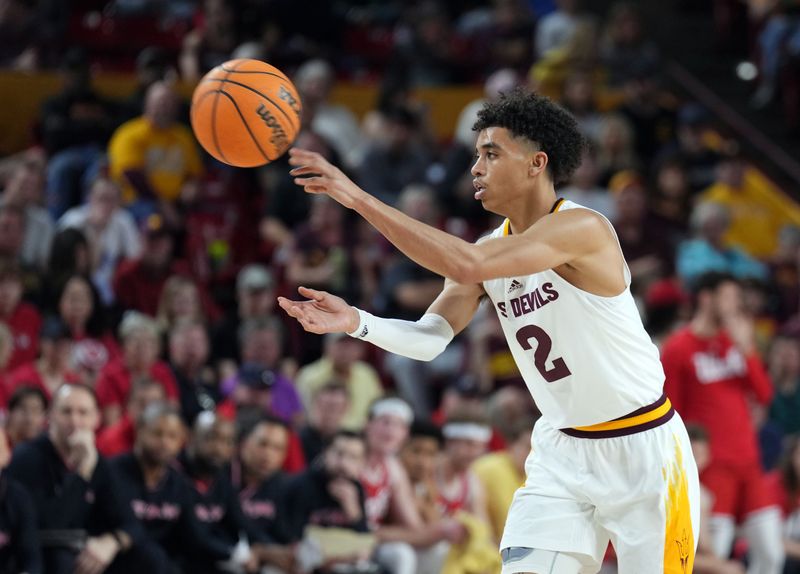 Feb 18, 2023; Tempe, Arizona, USA; Arizona State Sun Devils guard Austin Nunez (2) passes the ball against the Utah Utes during the second half at Desert Financial Arena. Mandatory Credit: Joe Camporeale-USA TODAY Sports