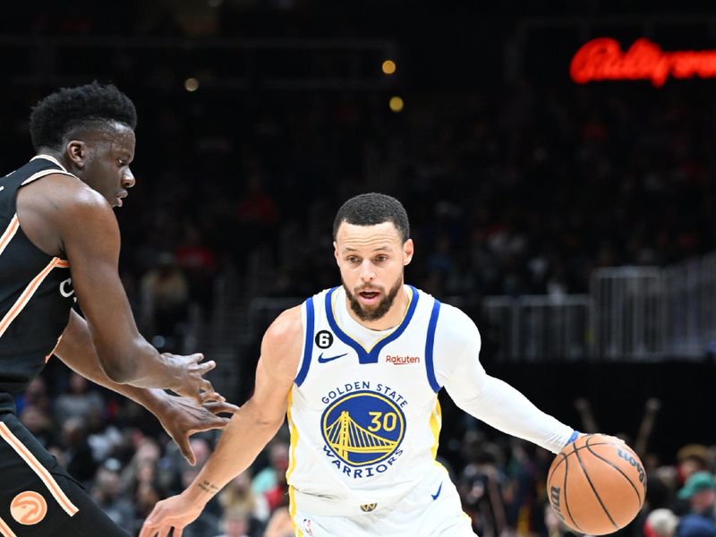 ATLANTA, GA - MARCH 17: Stephen Curry #30 of the Golden State Warriors dribbles the ball during the game against the Atlanta Hawks on March 17, 2023 at State Farm Arena in Atlanta, Georgia.  NOTE TO USER: User expressly acknowledges and agrees that, by downloading and/or using this Photograph, user is consenting to the terms and conditions of the Getty Images License Agreement. Mandatory Copyright Notice: Copyright 2023 NBAE (Photo by Adam Hagy/NBAE via Getty Images)