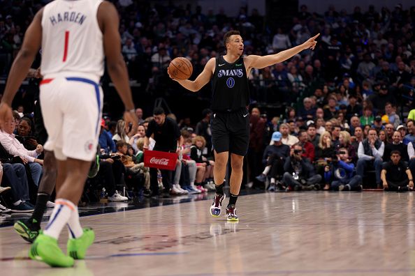 DALLAS, TEXAS - DECEMBER 20: Dante Exum #0 of the Dallas Mavericks dribbles the ball up court in the first half against the LA Clippers at American Airlines Center on December 20, 2023 in Dallas, Texas. NOTE TO USER: User expressly acknowledges and agrees that, by downloading and or using this photograph, User is consenting to the terms and conditions of the Getty Images License Agreement. (Photo by Tim Heitman/Getty Images)