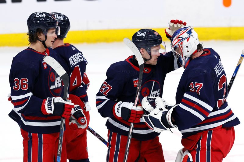 Feb 14, 2024; Winnipeg, Manitoba, CAN; Winnipeg Jets celebrate their victory over the San Jose Sharks at Canada Life Centre. Mandatory Credit: James Carey Lauder-USA TODAY Sports