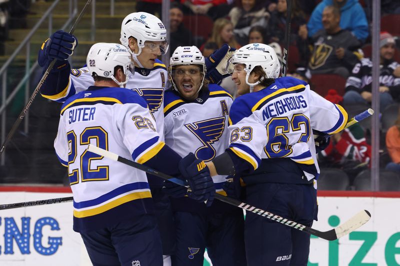 Nov 27, 2024; Newark, New Jersey, USA; St. Louis Blues center Dylan Holloway (81) celebrates his goal against the New Jersey Devils during the first period at Prudential Center. Mandatory Credit: Ed Mulholland-Imagn Images