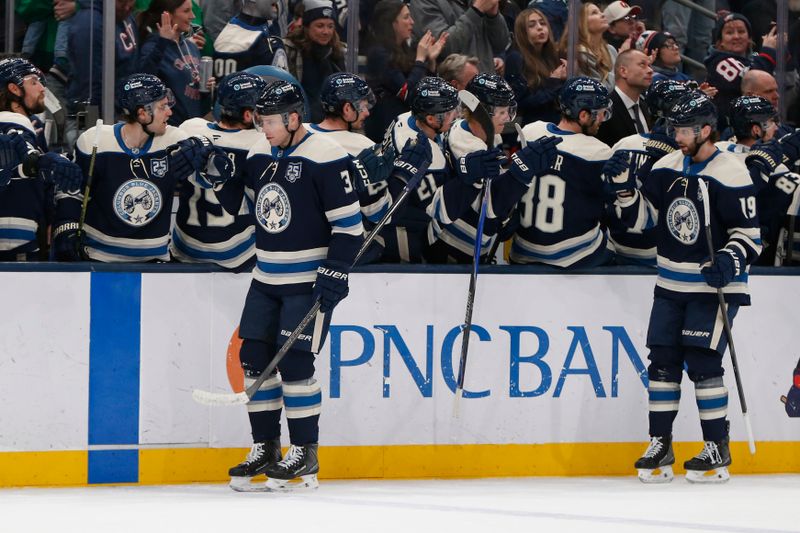 Mar 17, 2026; Columbus, Ohio, USA; Columbus Blue Jackets center Charlie Coyle (3) celebrates his goal against the Carolina Hurricanes during the first period at Nationwide Arena. Mandatory Credit: Russell LaBounty-Imagn Images