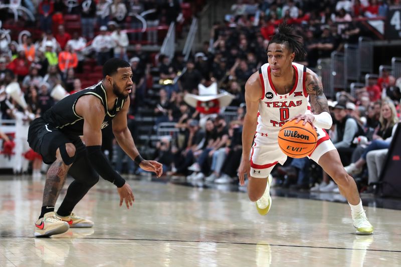 Feb 10, 2024; Lubbock, Texas, USA;  Texas Tech Red Raiders guard Chance McMillian (0) dribbles the ball against Central Florida Knights guard Darius Johnson (3) in the second half at United Supermarkets Arena. Mandatory Credit: Michael C. Johnson-USA TODAY Sports