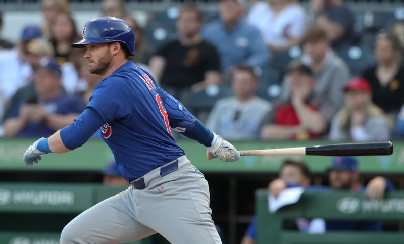 Apr 30, 2025; Pittsburgh, Pennsylvania, USA;  Chicago Cubs left fielder Ian Happ (8) hits a single against the Pittsburgh Pirates during the first inning at PNC Park. Mandatory Credit: Charles LeClaire-Imagn Images