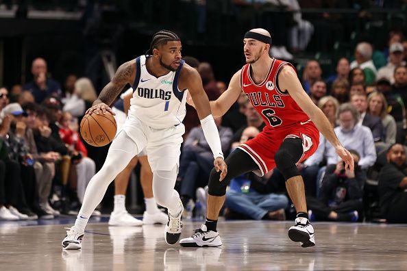 DALLAS, TEXAS - NOVEMBER 01: Jaden Hardy #1 of the Dallas Mavericks dribbles the ball against Alex Caruso #6 of the Chicago Bulls in the second half at American Airlines Center on November 01, 2023 in Dallas, Texas. NOTE TO USER: User expressly acknowledges and agrees that, by downloading and or using this photograph, User is consenting to the terms and conditions of the Getty Images License Agreement. (Photo by Tim Heitman/Getty Images)