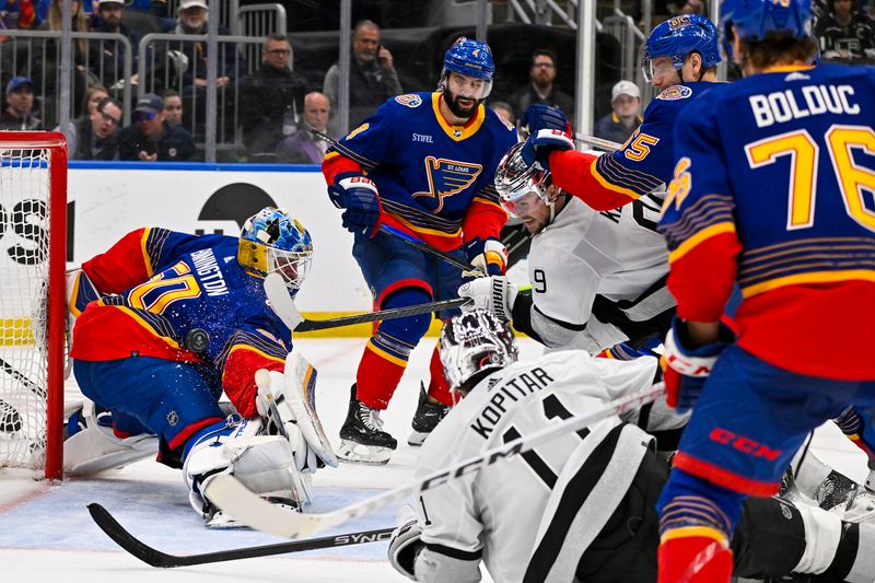 Mar 13, 2024; St. Louis, Missouri, USA;  Los Angeles Kings right wing Adrian Kempe (9) shoots and scores against St. Louis Blues goaltender Jordan Binnington (50) during the third period at Enterprise Center. Mandatory Credit: Jeff Curry-USA TODAY Sports