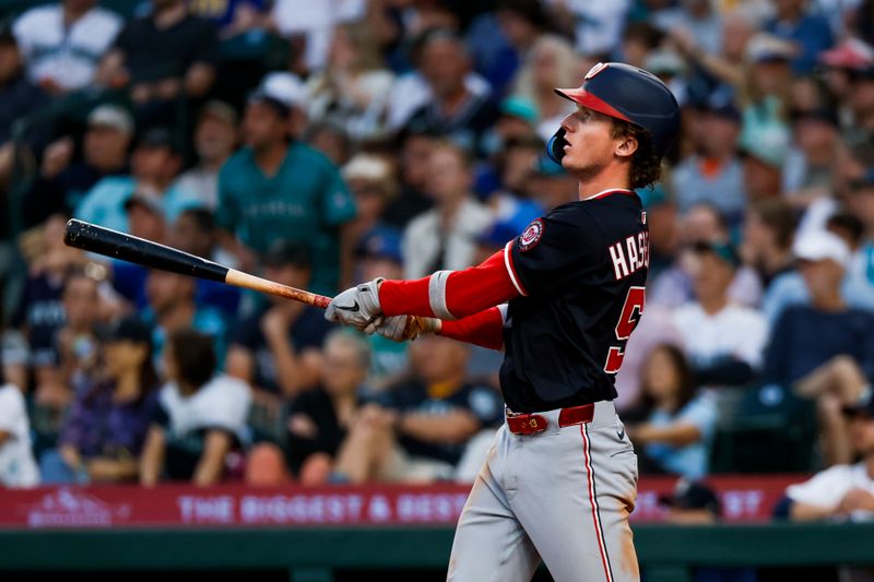 May 28, 2025; Seattle, Washington, USA; Washington Nationals center fielder Robert Hassell III (57) hits a solo-home run against the Seattle Mariners during the eighth inning at T-Mobile Park. Mandatory Credit: Joe Nicholson-Imagn Images