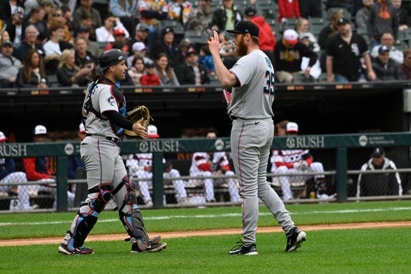 Jun 11, 2023; Chicago, Illinois, USA;  Miami Marlins catcher Nick Fortes (4) and Miami Marlins relief pitcher A.J. Puk (35) celebrate after beating the Chicago White Sox at Guaranteed Rate Field. Mandatory Credit: Matt Marton-USA TODAY Sports