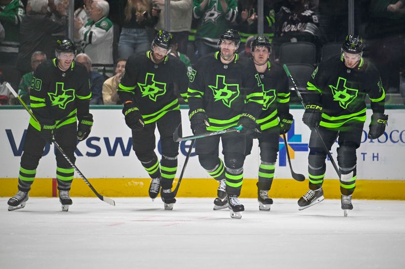 Mar 14, 2024; Dallas, Texas, USA; Dallas Stars defenseman Ryan Suter (20) and defenseman Jani Hakanpaa (2) and center Craig Smith (15) and center Ty Dellandrea (10) and center Radek Faksa (12) skate off the ice after Smith scores a goal against the New Jersey Devils during the first period at the American Airlines Center. Mandatory Credit: Jerome Miron-USA TODAY Sports